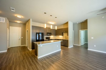 Harmony Luxury Apartments living room area with great natural lighting - Photo Gallery 10