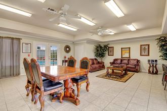 A shared space with tables and couches for resident use Lexington Court Resident Lounge Apartment rental in Abilene