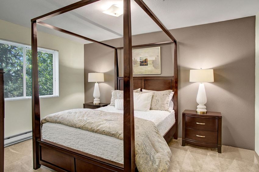 Bedroom with bed, desk, and window Allegro Bedroom Apartments in Covington, WA - Photo Gallery