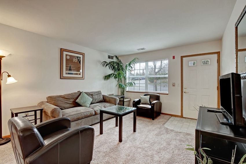 Arbor Ridge Living Room View with Couches, Television, and Window Arbor Ridge Living Room View, Dean Weidner Real Estate Apartments for rent Milwaukee, WI