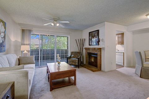 A living room with a fireplace and a couch.