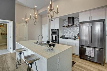 Variety of Interior Finishes with Black, White, or Stainless Steel Kitchen appliances