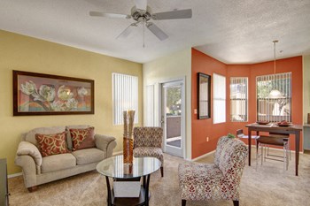 A living room with wide windows and a ceiling fan Arezzo Living Room - Photo Gallery 5