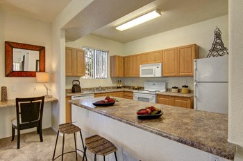 A kitchen with light cabinets and granite countertops Arezzo Kitchen - Photo Gallery 3