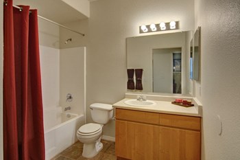 a bathroom with a toilet sink and bathtub - Photo Gallery 12