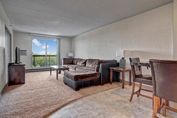 A large living room with window overlooking the property 2131 Broad Street Office 1-2 Beds Apartment, Saskatchewan, Canada Search for Rent - Photo Gallery 3