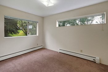 A bedroom with overhead lighting and two windows Chugach South Bedroom - Photo Gallery 4