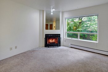 A galley-style kitcen with a view into the living room Chugach South Living Room - Photo Gallery 5