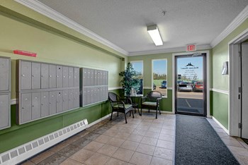The hall to the leasing office with mailboxes for residents Edgewood Estates Leasing Office - Photo Gallery 4