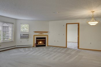 Heritage Park Living Room with Beautiful Fireplace in Select Units Heritage Park Living Room - Photo Gallery 3