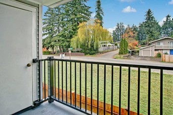 The view from the balcony overlooking the lawn. The balcony also has access to an additional private storage area Heron View Exterior - Photo Gallery 6