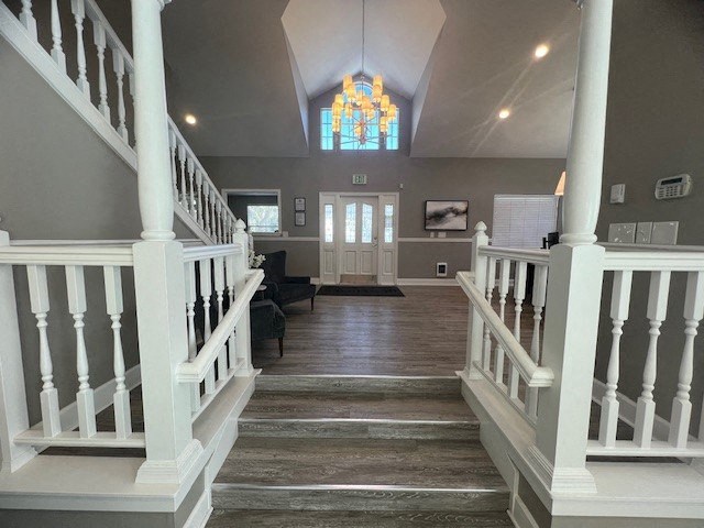 a large hallway with stairs and a church door
