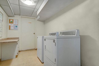 A shared laundry facility for residents Kingsmere Apartment Homes Laundry - Photo Gallery 5