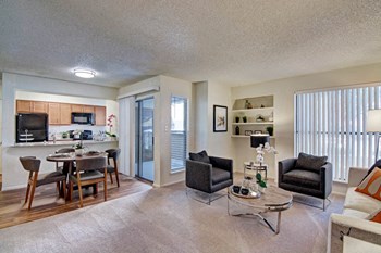 A living room with a large sliding glass door Motif Living Room - Photo Gallery 5