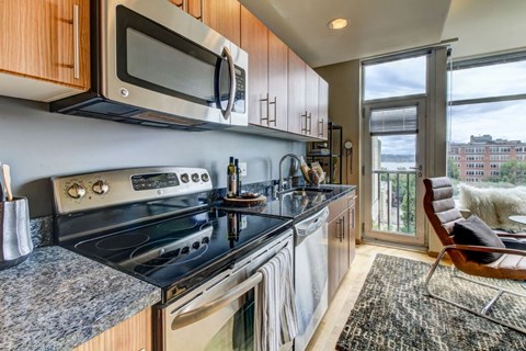 a kitchen with a stove top oven and a microwave