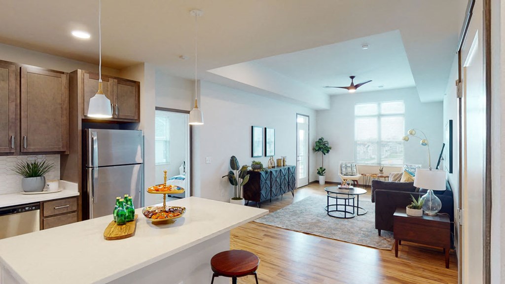 a kitchen and living room in an open floor plan