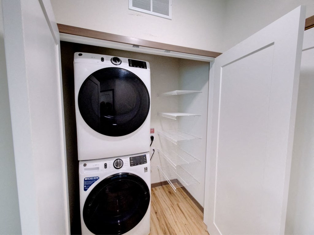 a white washer and dryer in a laundry room