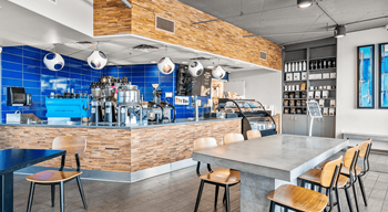 a restaurant with a bar and tables and chairs