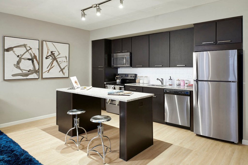 4Marq - Kitchen with Island and Stainless Steel Appliances