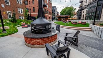 a group of chairs sitting around a fire pit