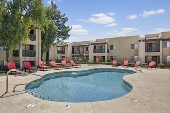 An outdoor pool with lounge chairs Property Image