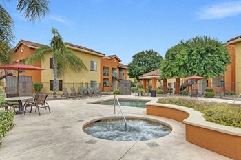 An outdoor pool with lounge chairs Property Image