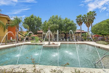 An outdoor pool with lounge chairs Property Image