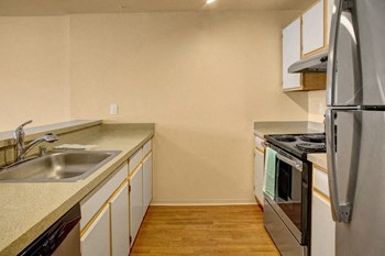 Stainless steel appliances with lots of cabinet storage and dishwasher St James Kitchen - Photo Gallery 2