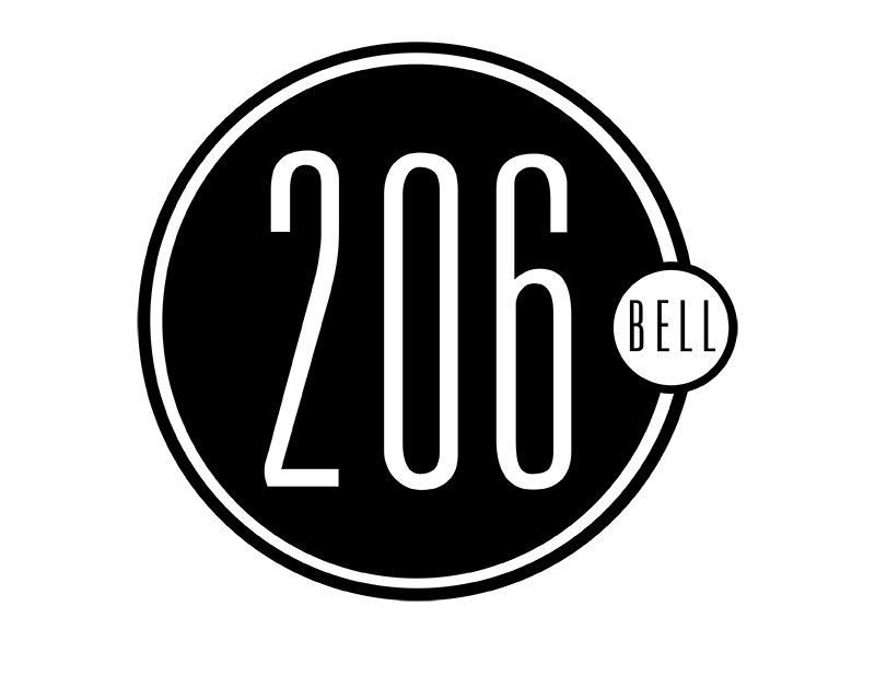 a person standing in front of a black wall