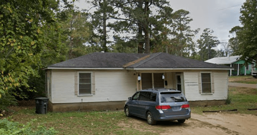a house with a car parked in front of it