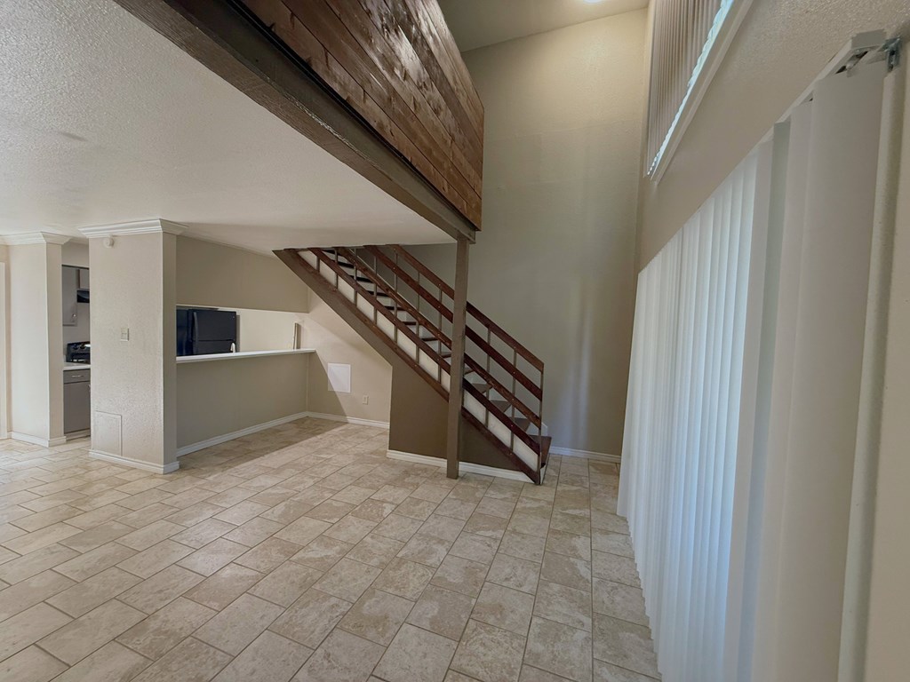 Spacious loft living room in a Sierra Ranch apartment home in San Antonio, TX.