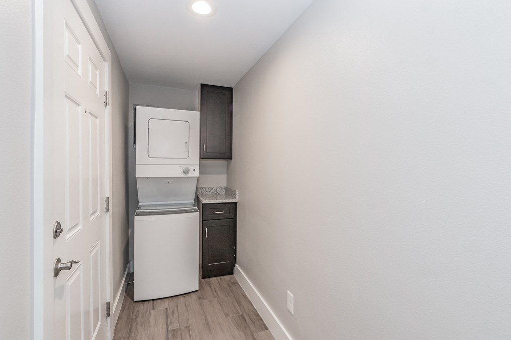 Stacked washer and dryer in Riata Park apartment