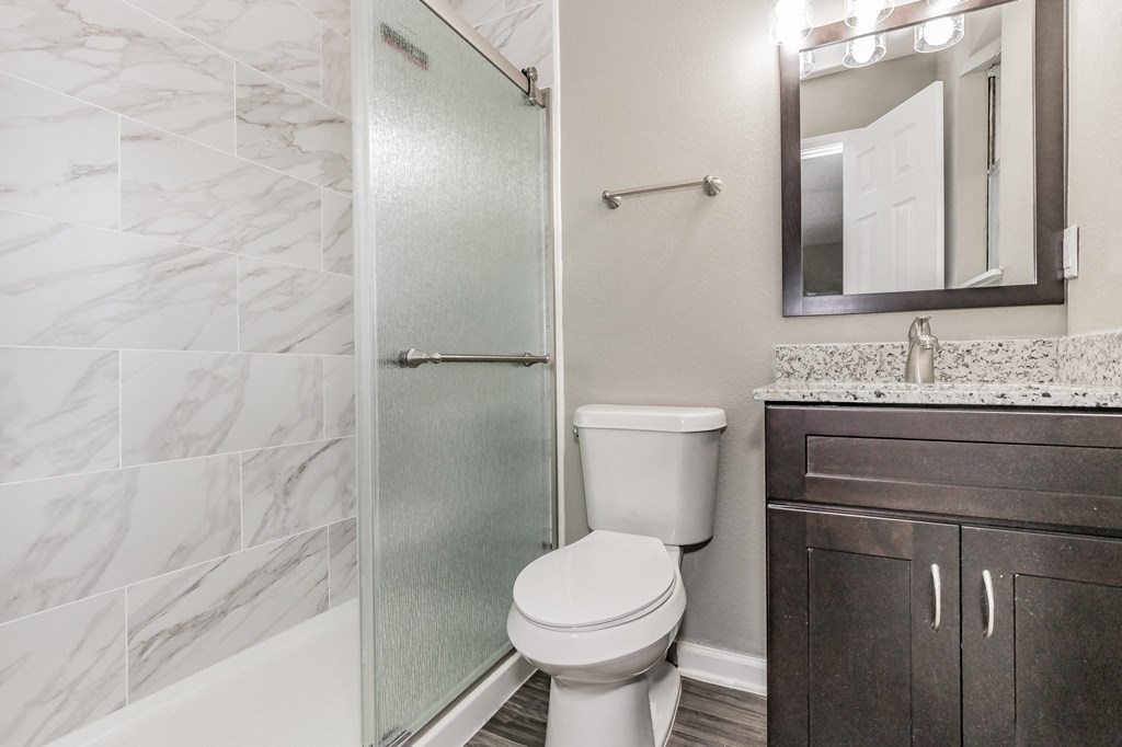Bathroom with modern vanity and shower at Chapel Creek Apartments Dallas