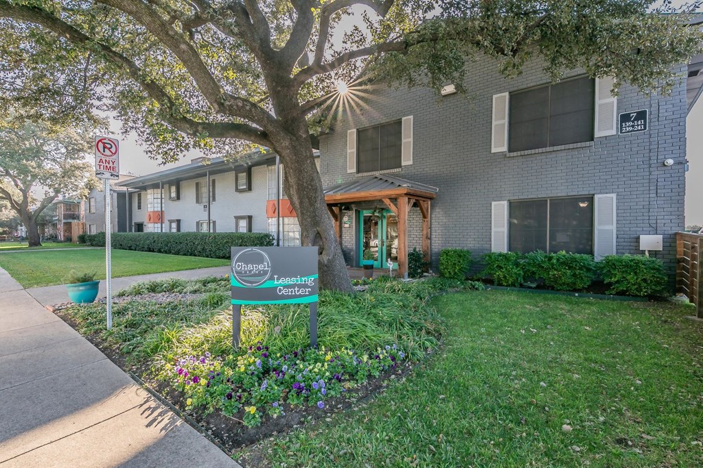 Chapel Creek Apartments exterior with landscaped walkways in Dallas