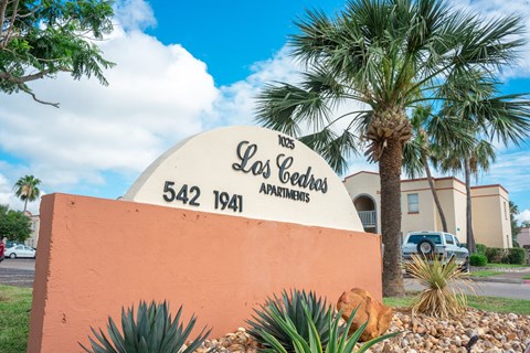 Monument sign for Los Cedros Apartments in Brownsville, Texas