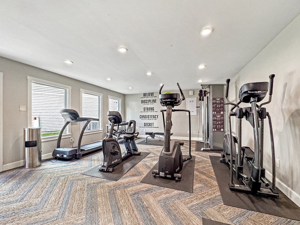 Fitness center with treadmills and cardio equipment at Towne Oaks Apartments.