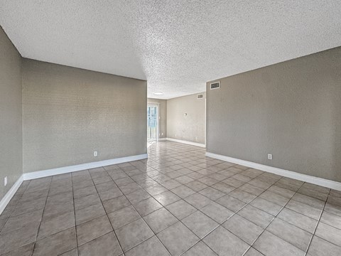 Open living room with neutral walls – Borders Apartments Brownsville TX