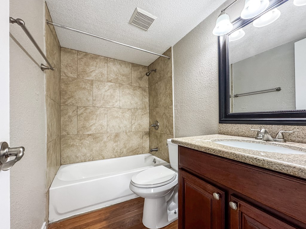 Bathroom with vanity and tile shower – Borders Apartments Brownsville TX