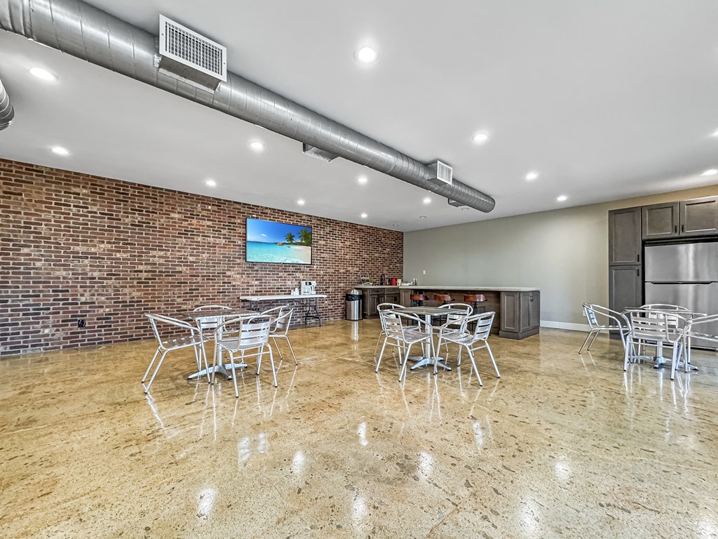 Clubhouse interior with seating area and bright lighting