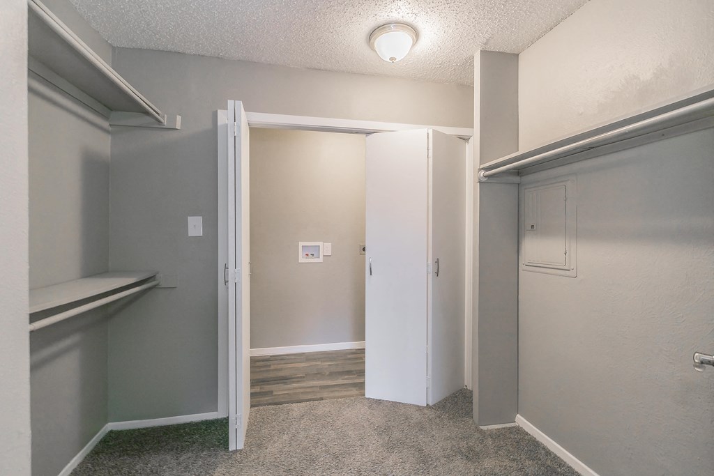 Hallway entry with closet and neutral flooring