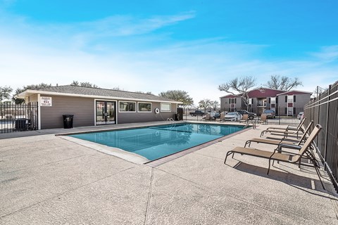 Poolside view of Sage Creek Apartments community in Victoria TX