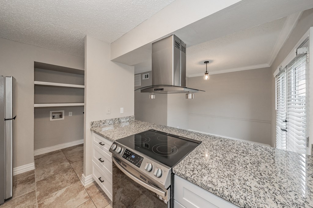 Kitchen breakfast bar with granite countertops