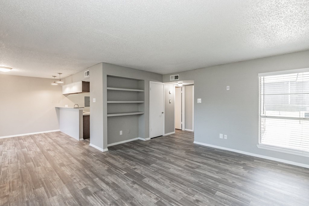 Bedroom with neutral tones, ceiling fan, and natural light at Station 121 Apartments