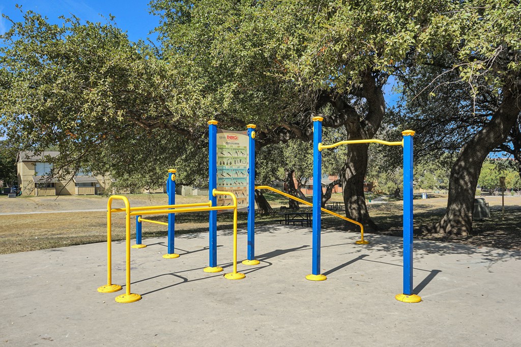Walking trail with outdoor exercise stations at Sierra Ranch Apartments in San Antonio, TX.