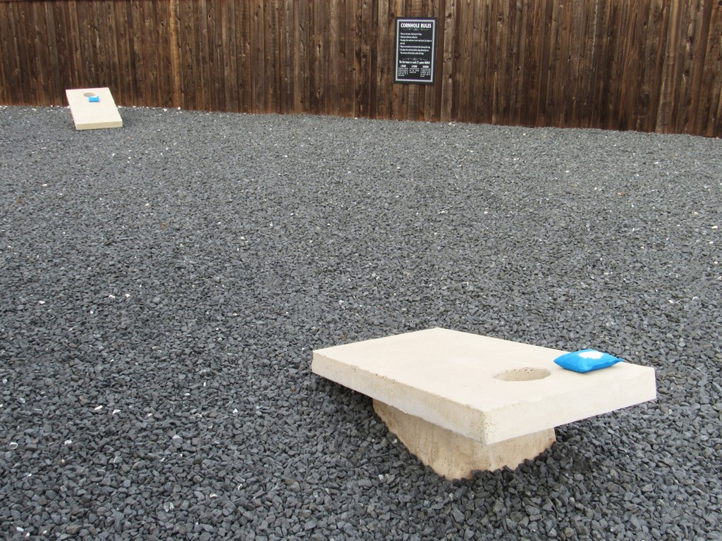 a stone table with a blue item on it on the ground