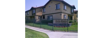 A house with a black fence and a sign that says "Ridgewood".