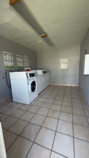 A laundry room with a washer and dryer.