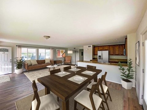 A dining room with a wooden table and chairs.
