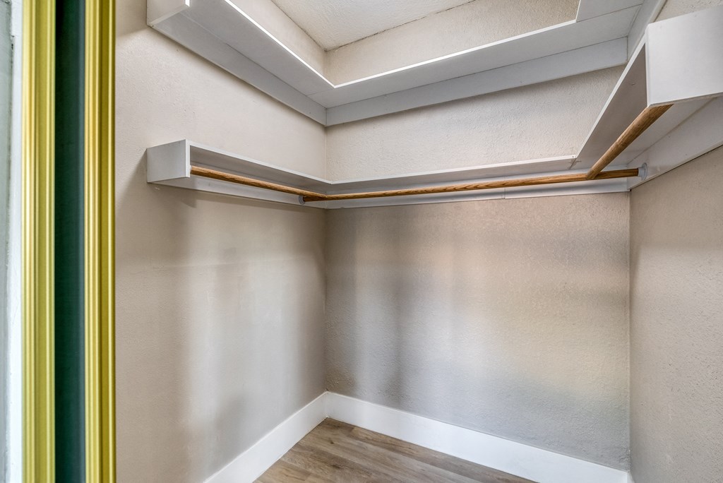 a room with white walls and a wooden floor