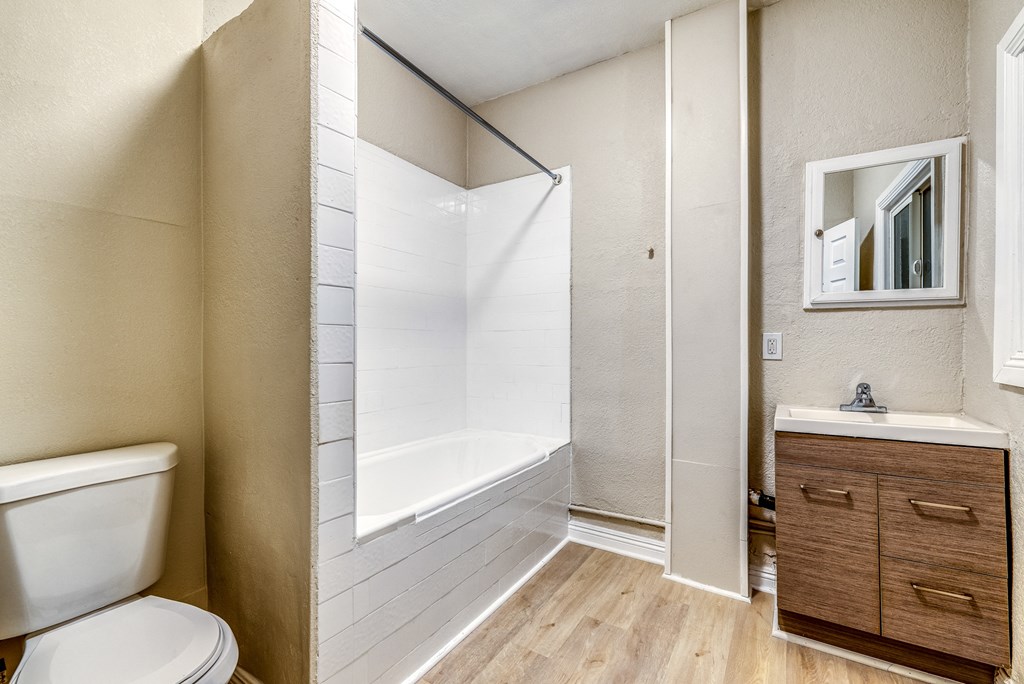 a bathroom with a bathtub and a sink